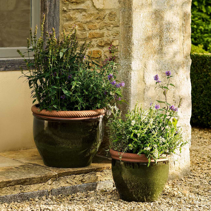 Coleshill Olive Green ceramic planters by Garden Trading in Small and Large sizes, styled outdoors