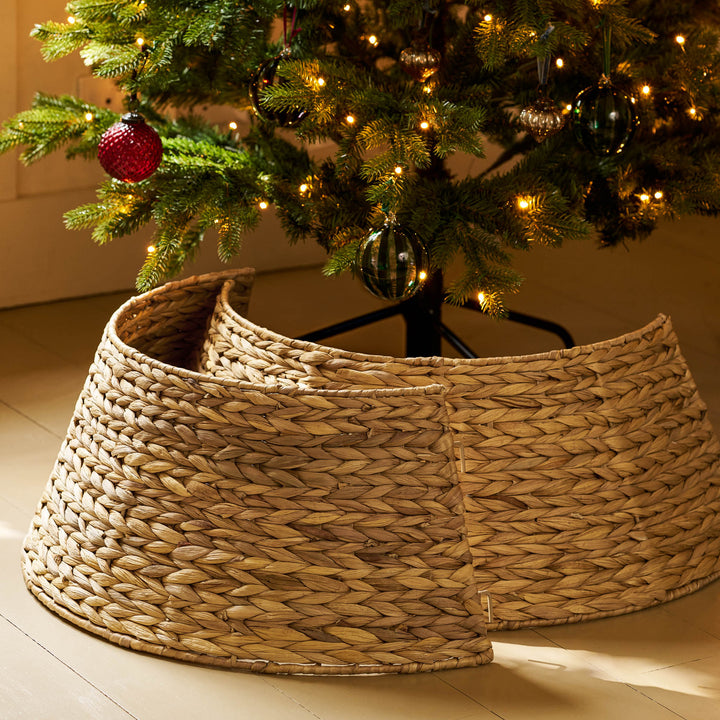 Aston seagrass Christmas tree skirt showing its two separate halves around a tree stand